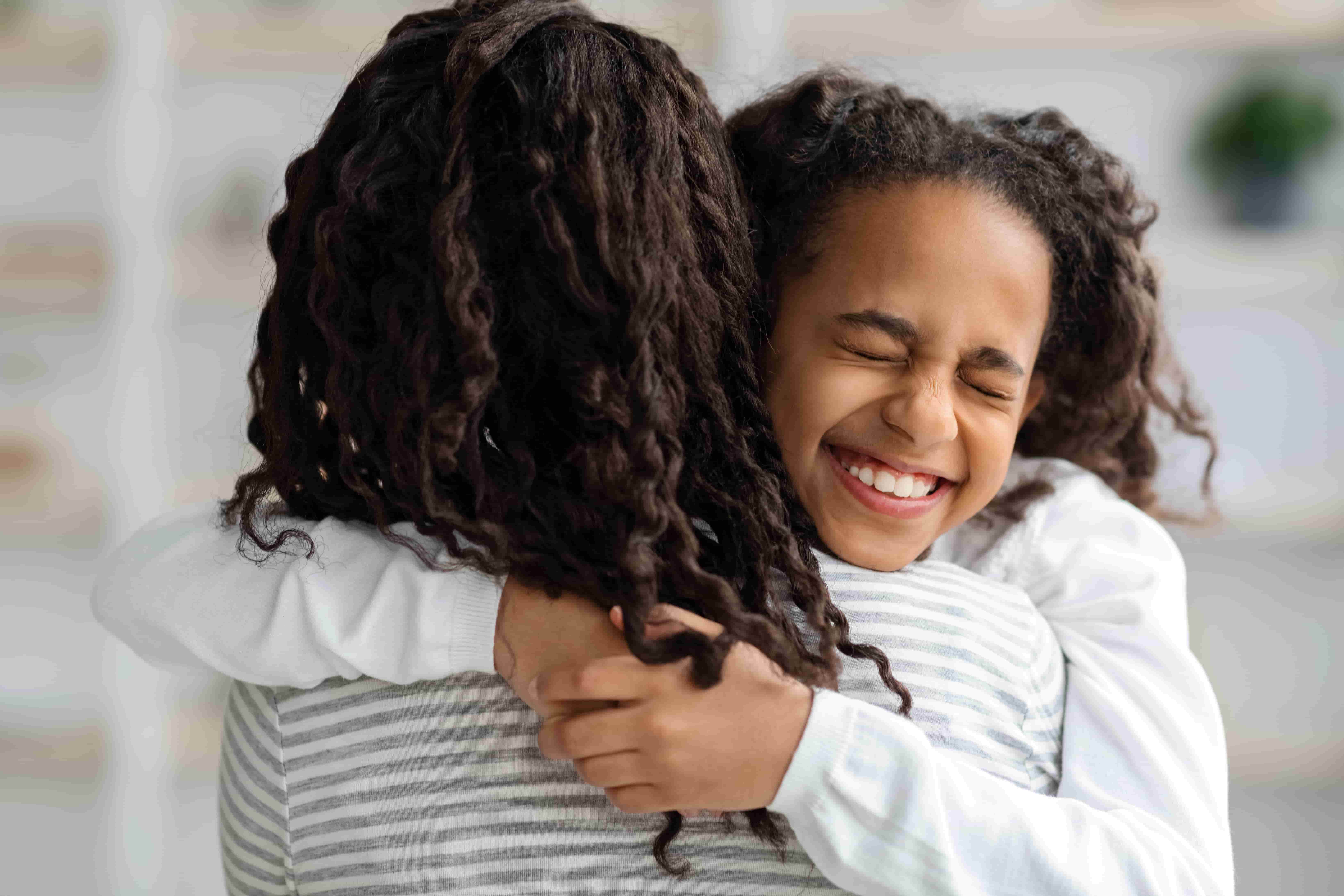 Mom and daughter hugging